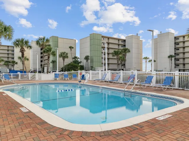 a view of a swimming pool and a chairs