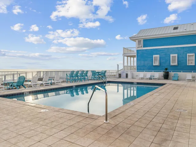 a view of a swimming pool with a deck