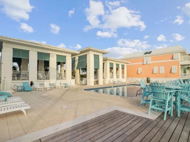 a view of swimming pool with outdoor seating