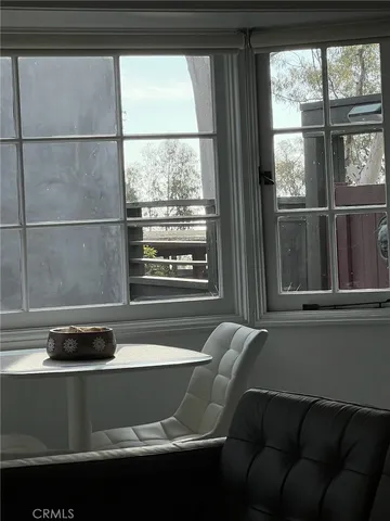 a living room with a couch and a window