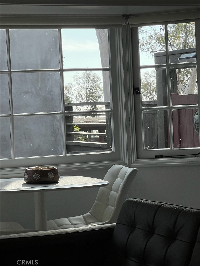 388 Hawthorne Road, Unit A Laguna Beach, CA 92651 - Photo 14 of 19 a living room with a couch and a window