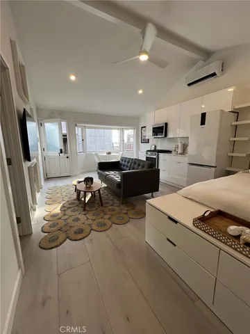 a kitchen with sink refrigerator and cabinets