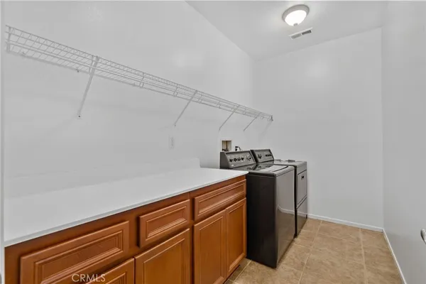 a view of a storage and utility room with closet
