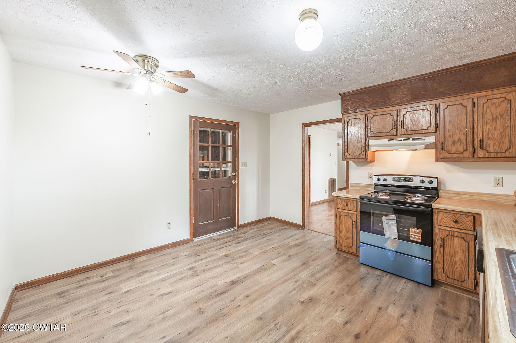 222 Dustin Drive Jackson, TN 38301 - Photo 11 of 30 a kitchen with stainless steel appliances granite countertop a stove cabinets and entryway