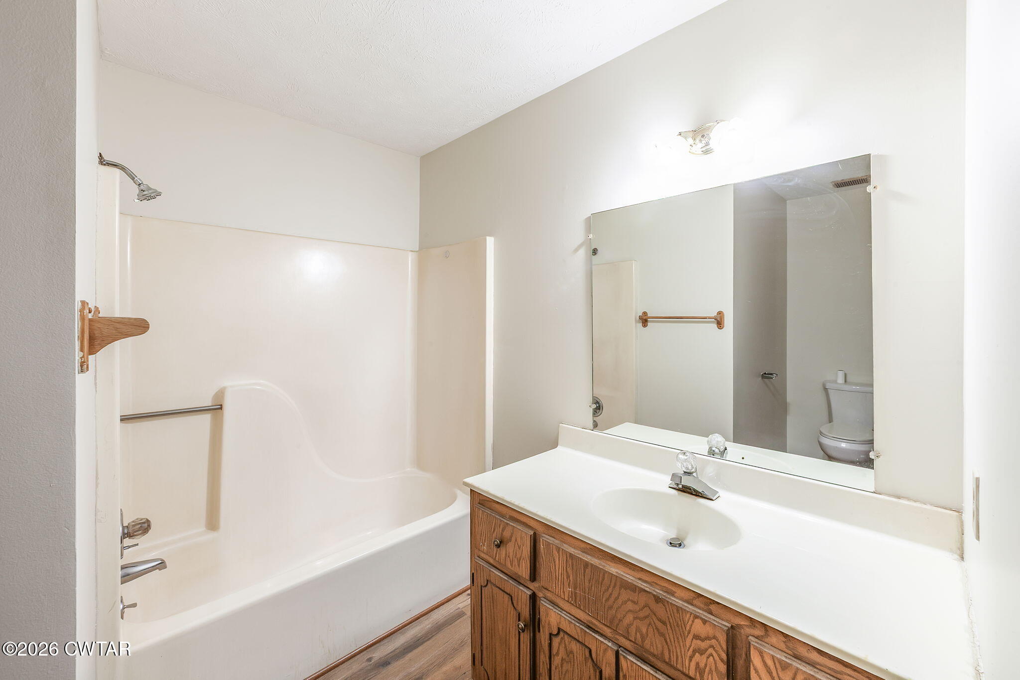222 Dustin Drive Jackson, TN 38301 - Photo 17 of 30 a bathroom with a tub sink and mirror