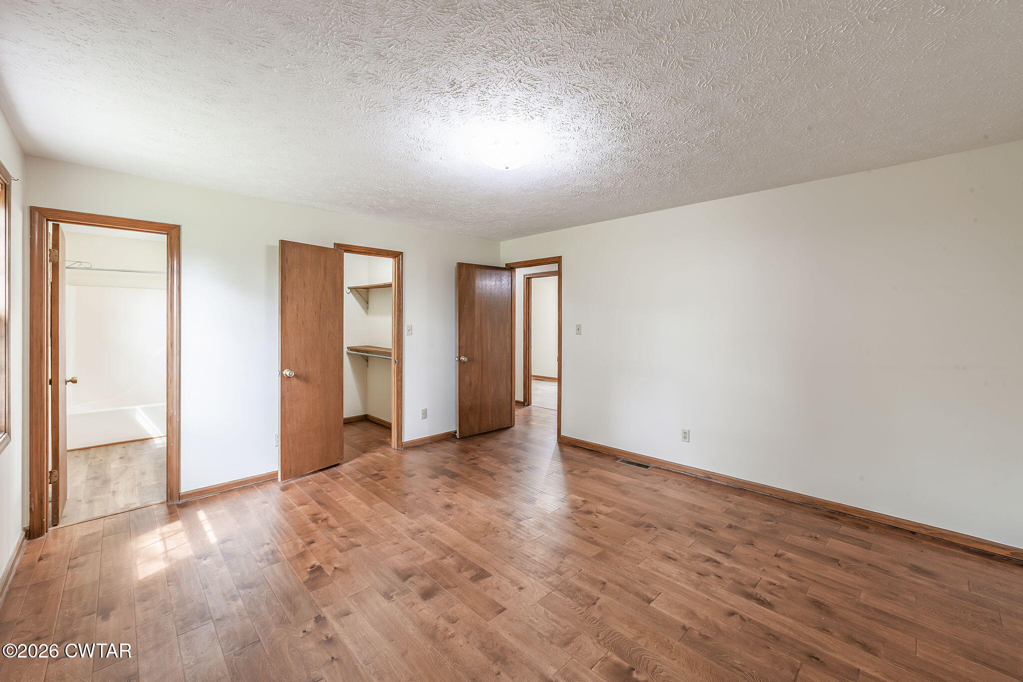 222 Dustin Drive Jackson, TN 38301 - Photo 21 of 30 a view of an empty room with wooden floor