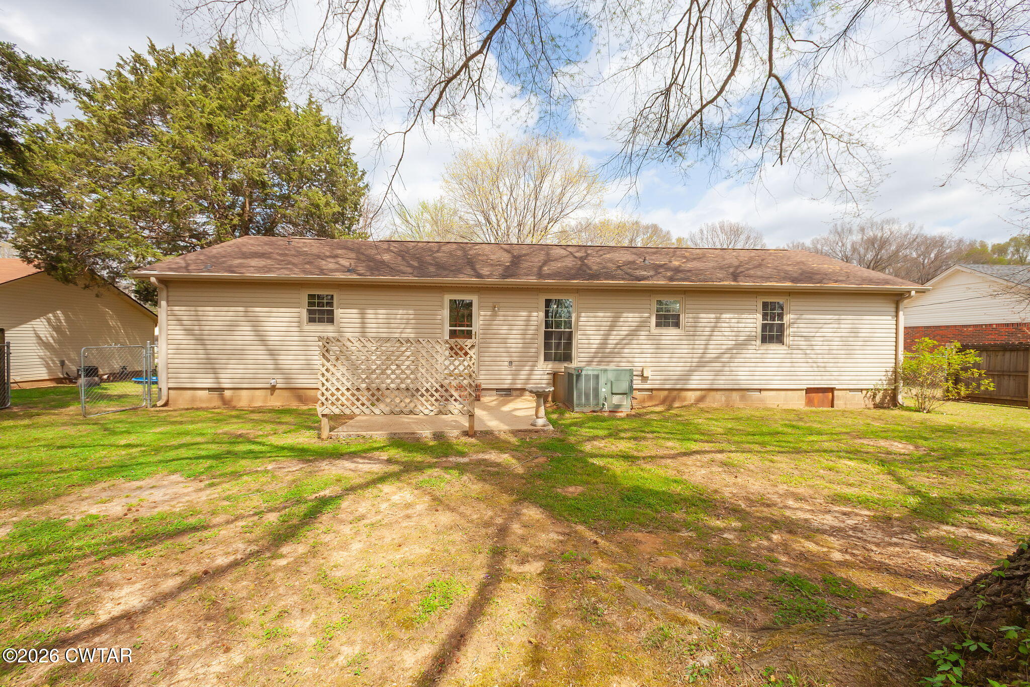 222 Dustin Drive Jackson, TN 38301 - Photo 28 of 30 a front view of a house with a yard
