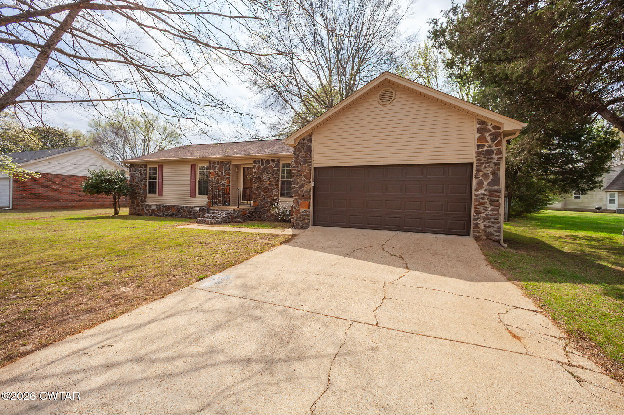 222 Dustin Drive Jackson, TN 38301 - Photo 29 of 30 a front view of house with yard and trees around