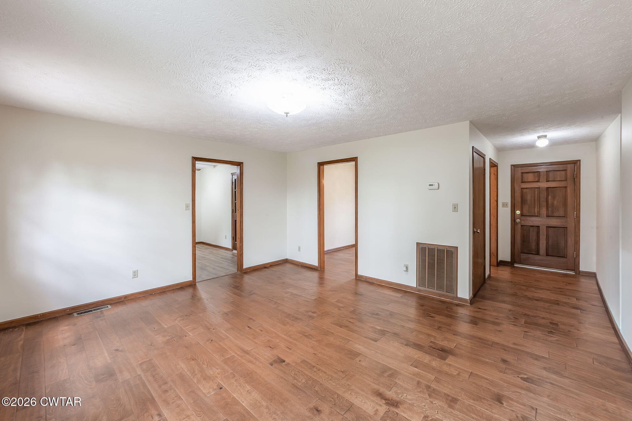 222 Dustin Drive Jackson, TN 38301 - Photo 3 of 30 a view of an empty room with wooden floor and closet