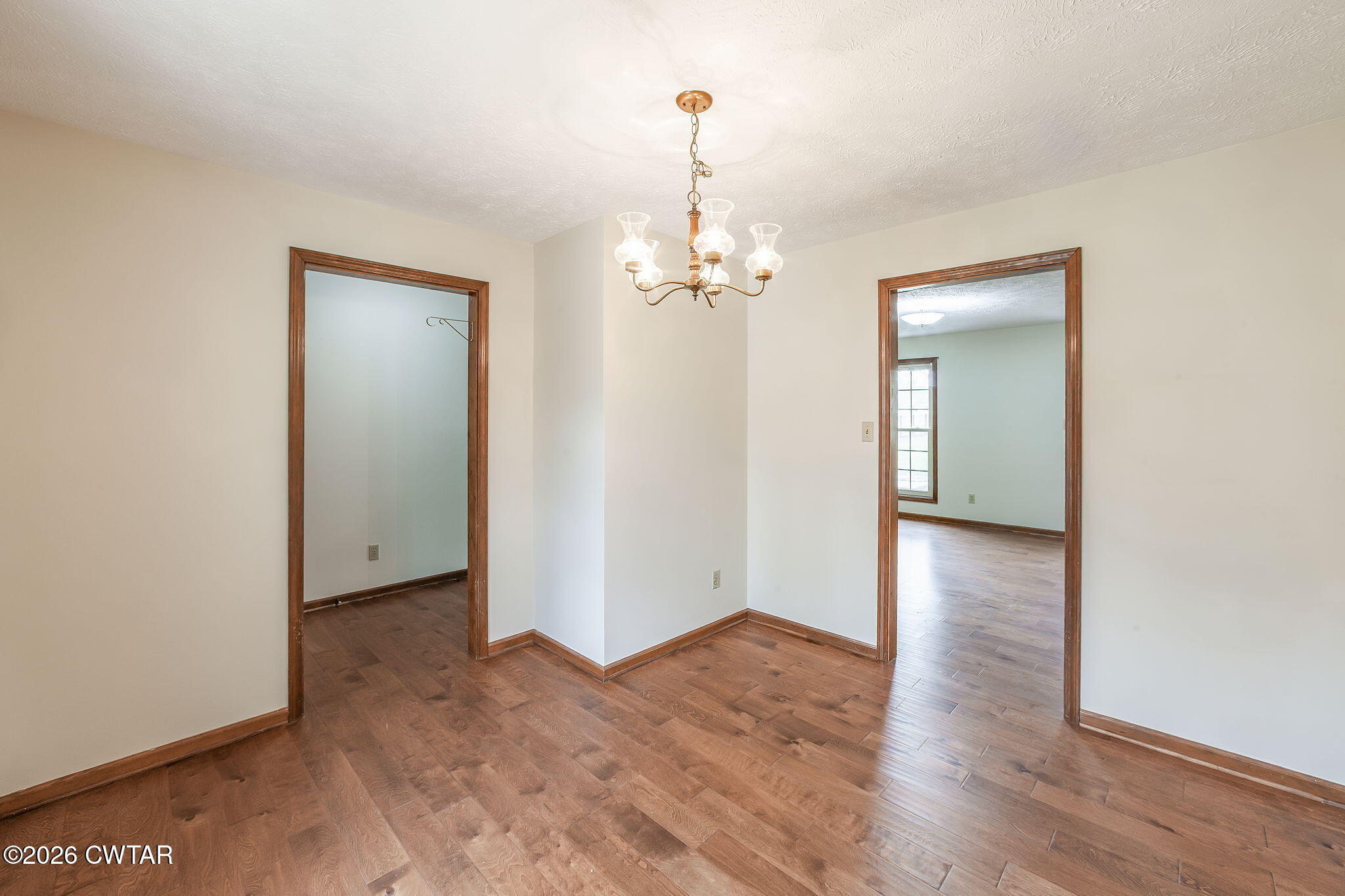 222 Dustin Drive Jackson, TN 38301 - Photo 6 of 30 a view of a room with wooden floor and a ceiling fan