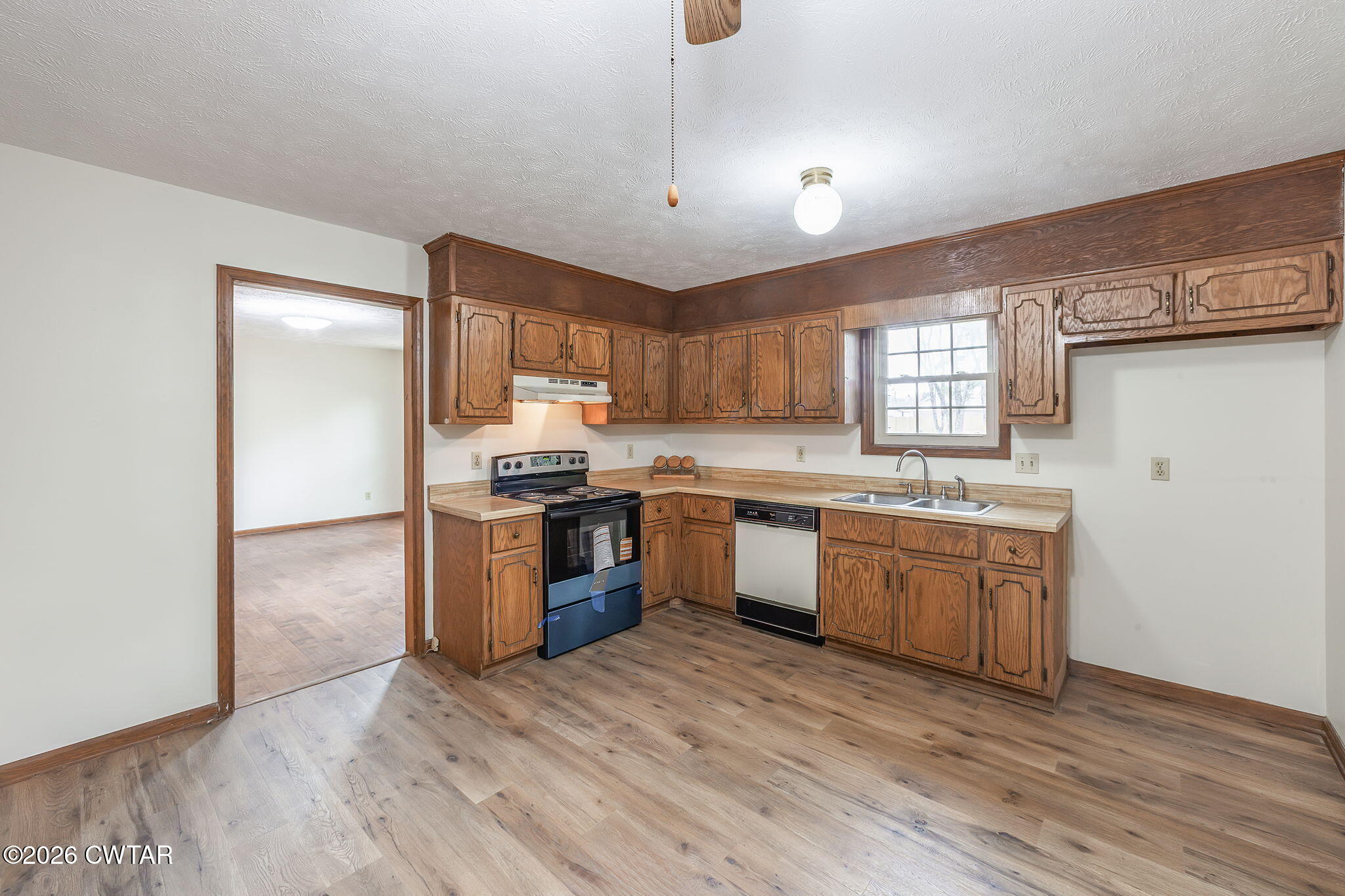 222 Dustin Drive Jackson, TN 38301 - Photo 10 of 30 a kitchen with granite countertop a refrigerator stove top oven and sink