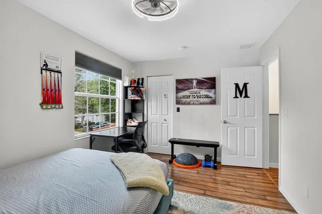 a bedroom with furniture and a window