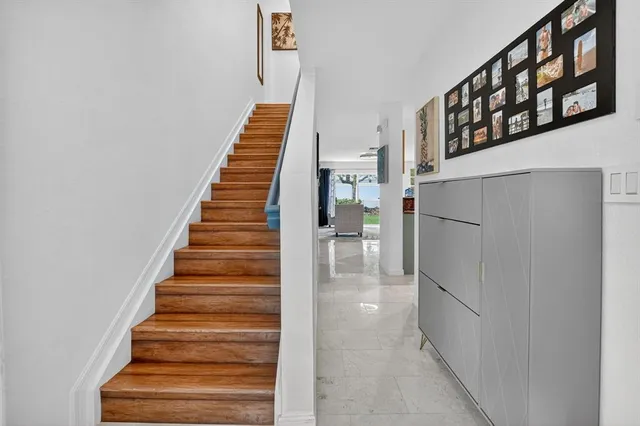 a view of entryway and hall with wooden floor