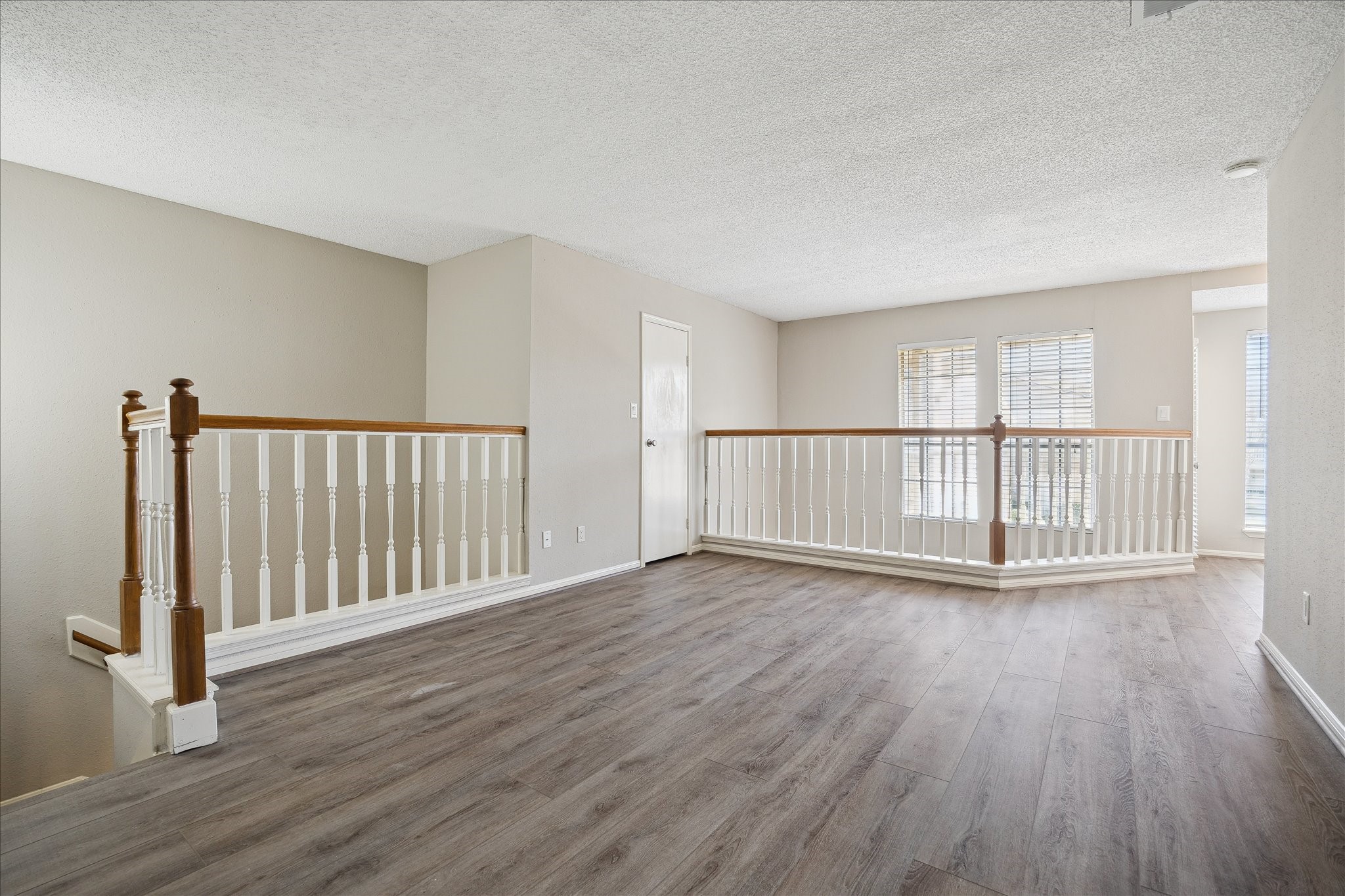 7575 Cambridge Street, Unit 1003 Houston, TX 77054 - Photo 17 of 27 a view of an empty room with wooden floor