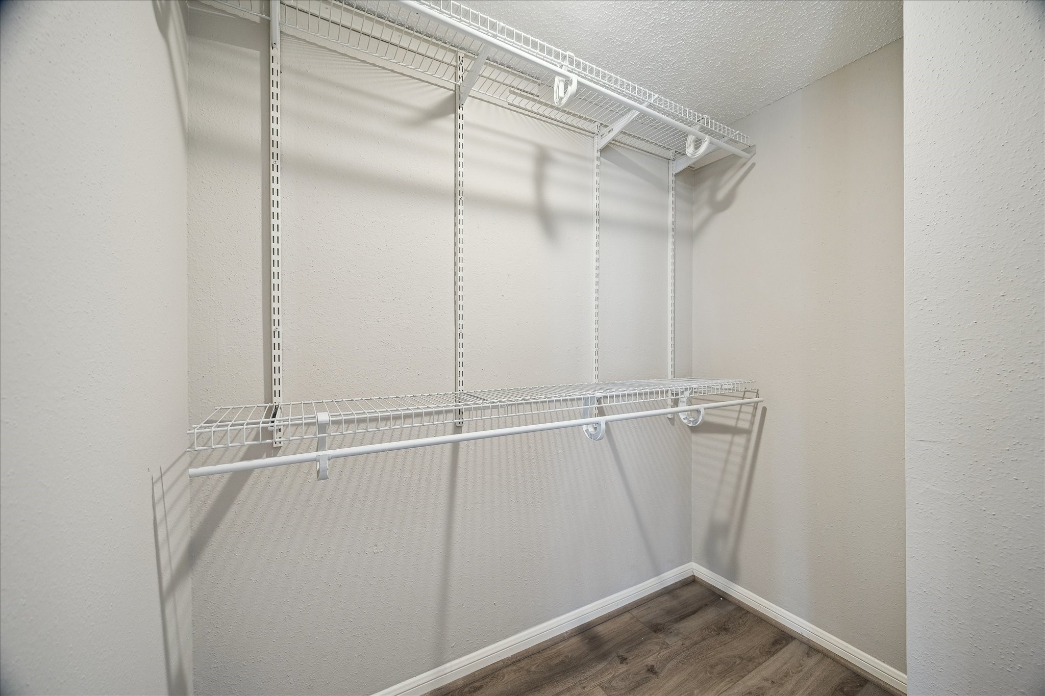 7575 Cambridge Street, Unit 1003 Houston, TX 77054 - Photo 20 of 27 a view of a room with racks on the wall