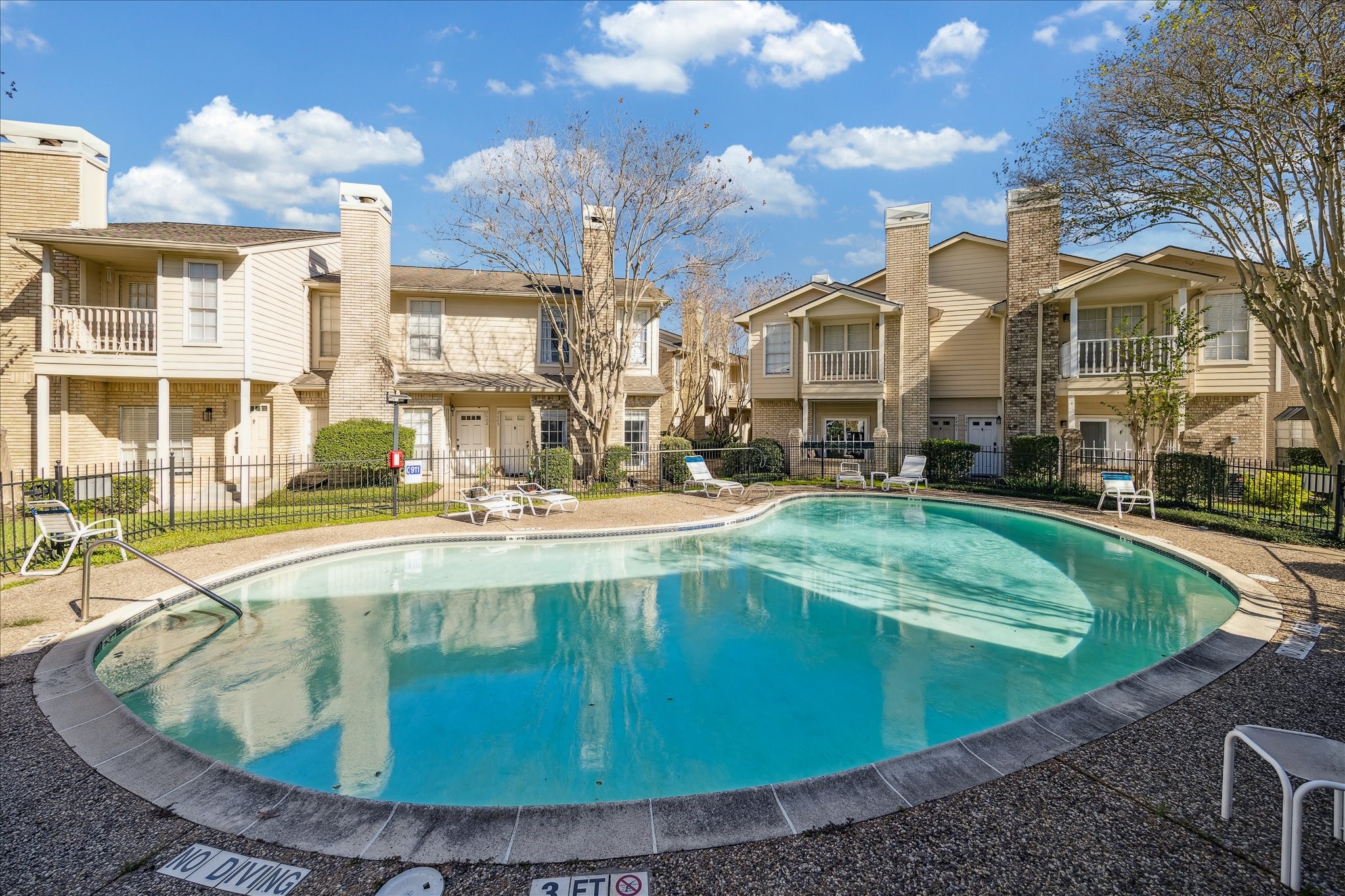 7575 Cambridge Street, Unit 1003 Houston, TX 77054 - Photo 3 of 27 a view of a swimming pool with a yard