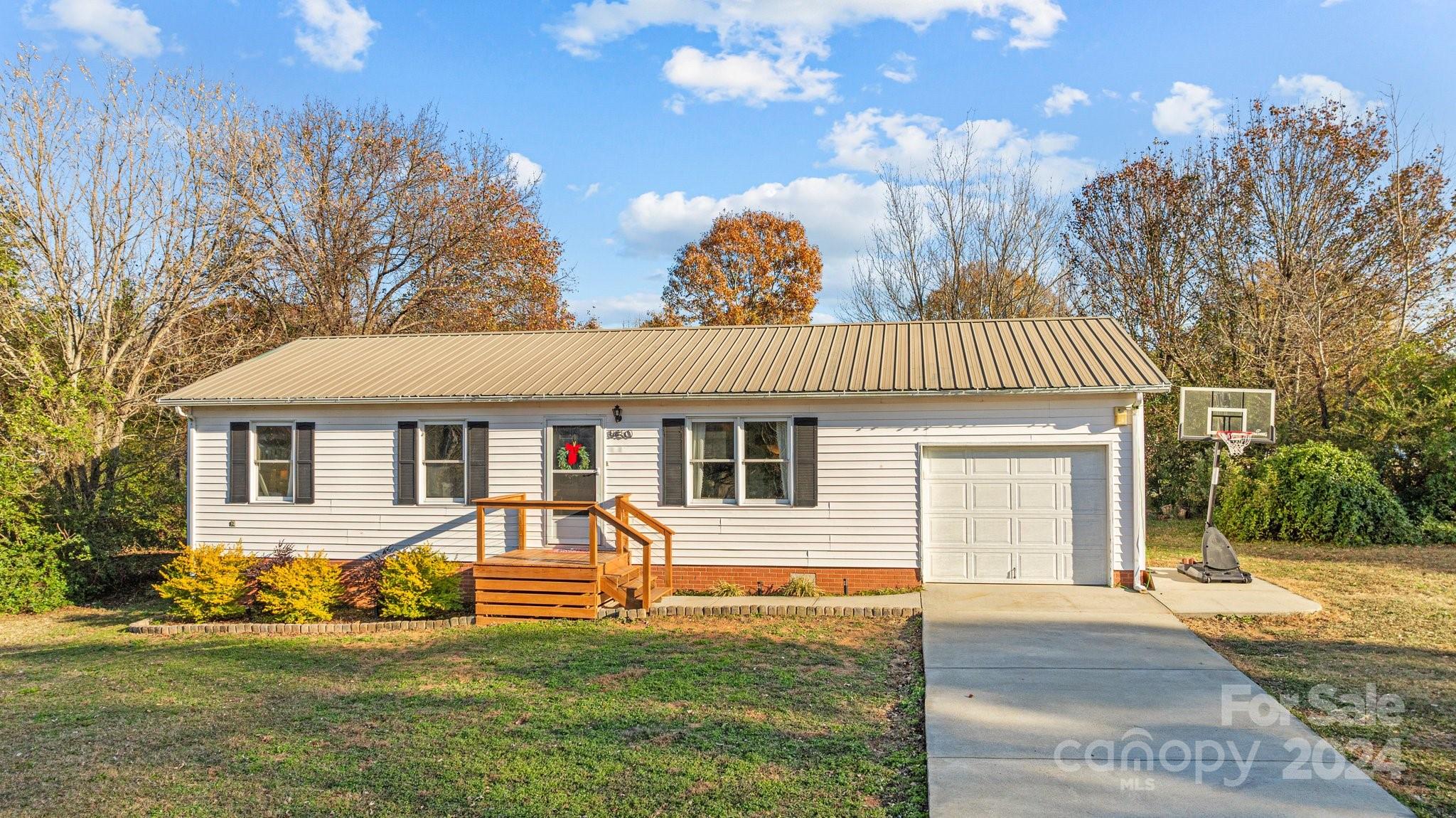 8450 Renee Ford Road Stanfield, NC 28163 - Photo 1 of 39 a view of a house with a yard