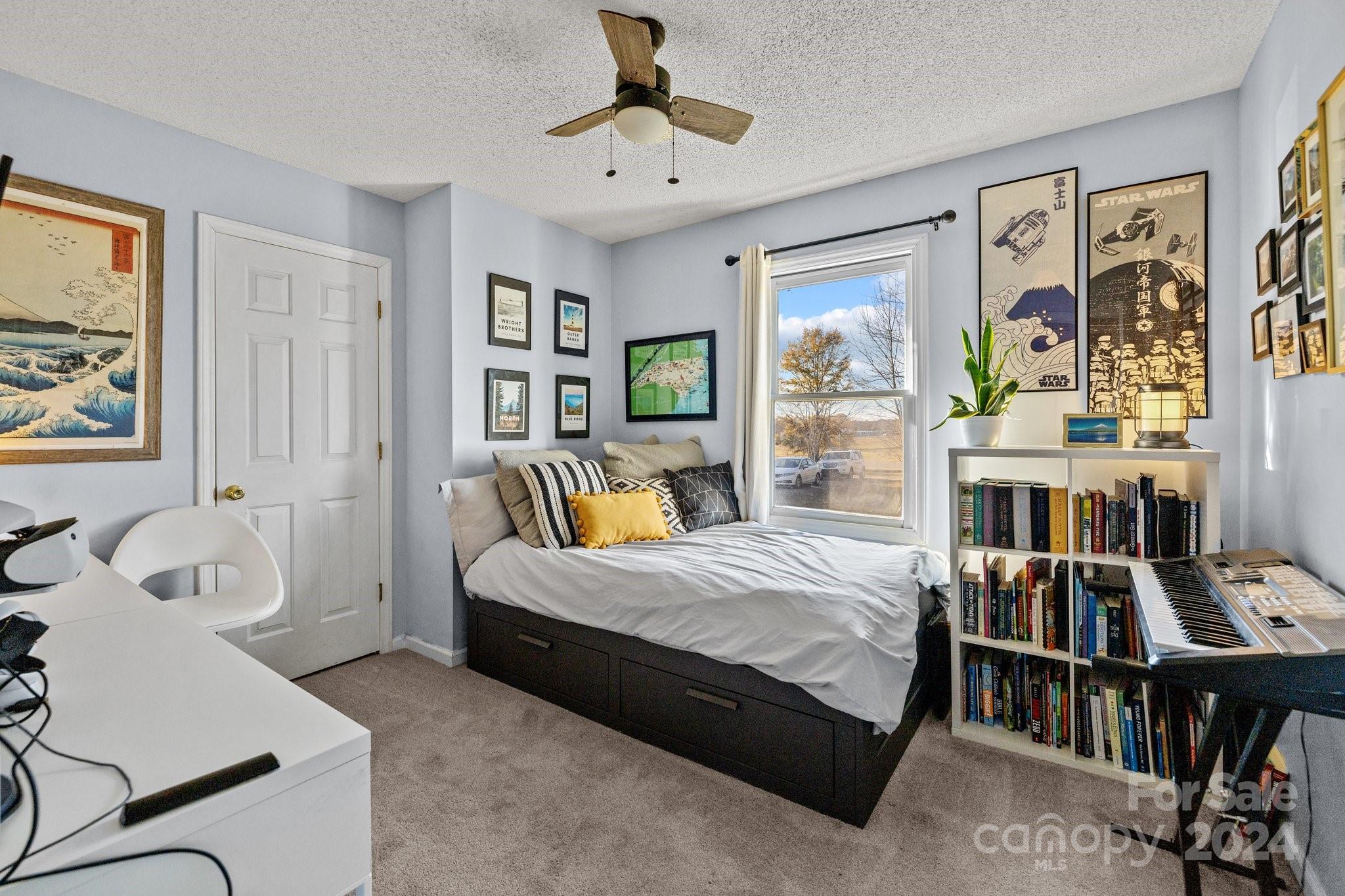 8450 Renee Ford Road Stanfield, NC 28163 - Photo 15 of 39 a bedroom with a bed furniture and two windows