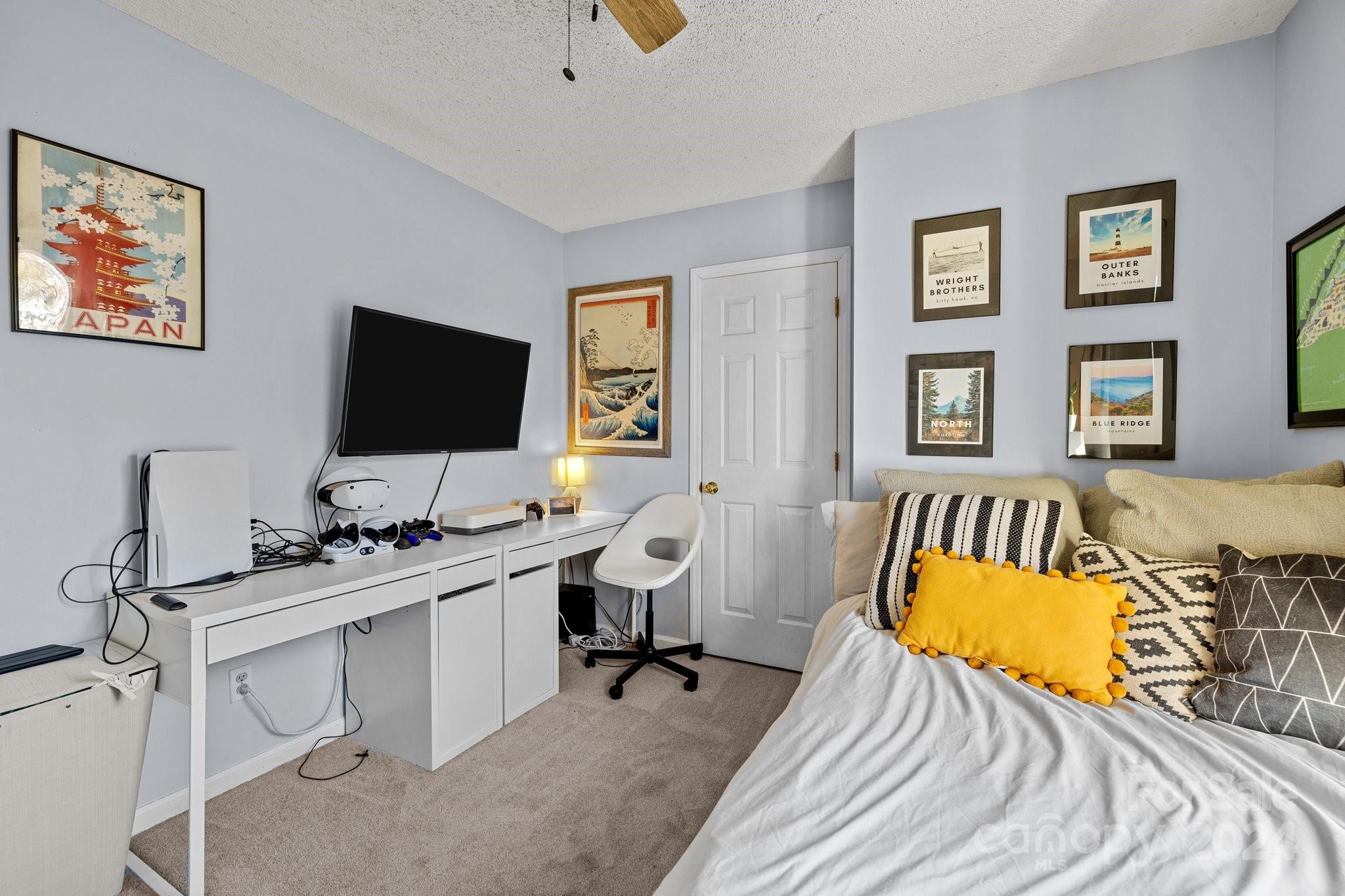 8450 Renee Ford Road Stanfield, NC 28163 - Photo 16 of 39 a bedroom with a workspace