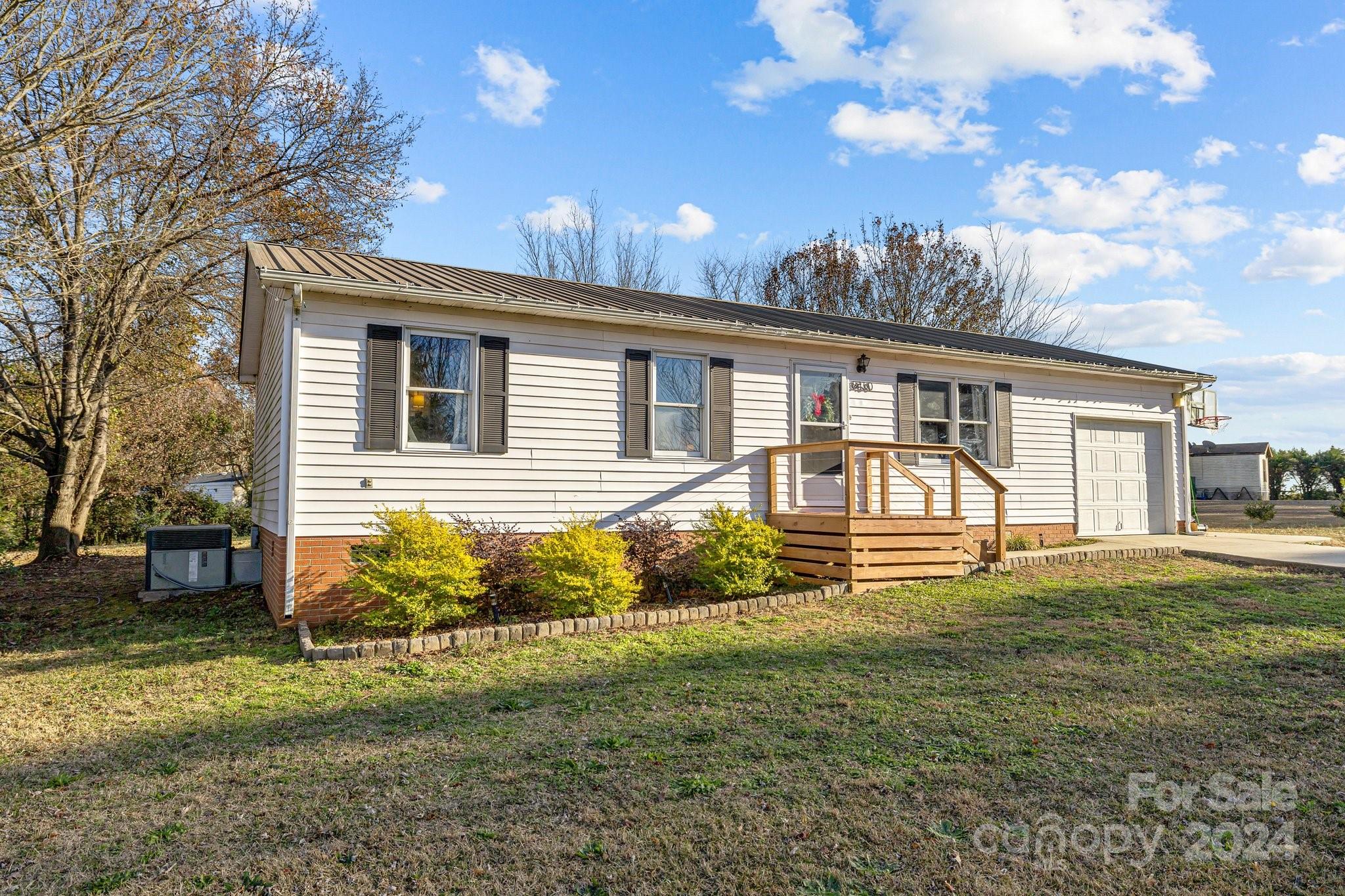 8450 Renee Ford Road Stanfield, NC 28163 - Photo 29 of 39 a front view of a house with a yard