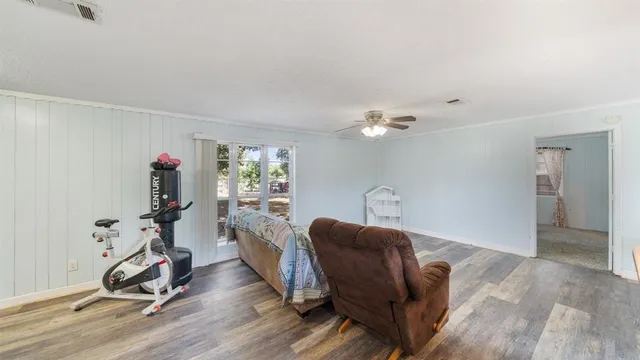 a view of a livingroom with furniture and a window