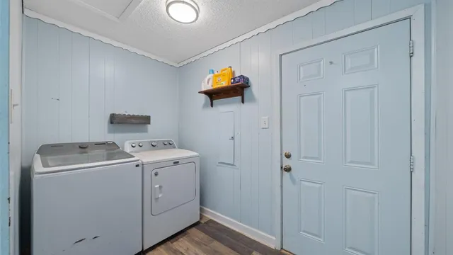 a view of storage and utility room with washer and dryer