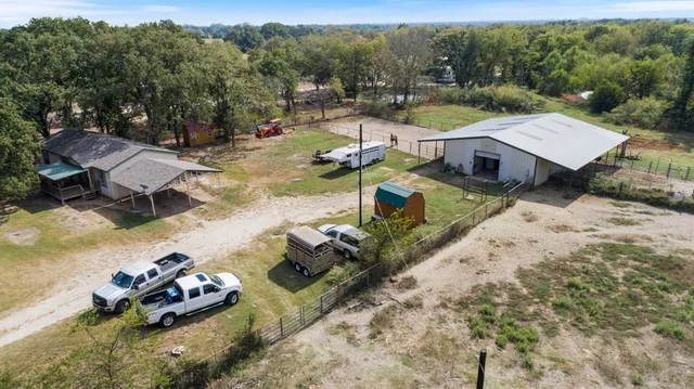 a view of a house with pool patio and outdoor seating