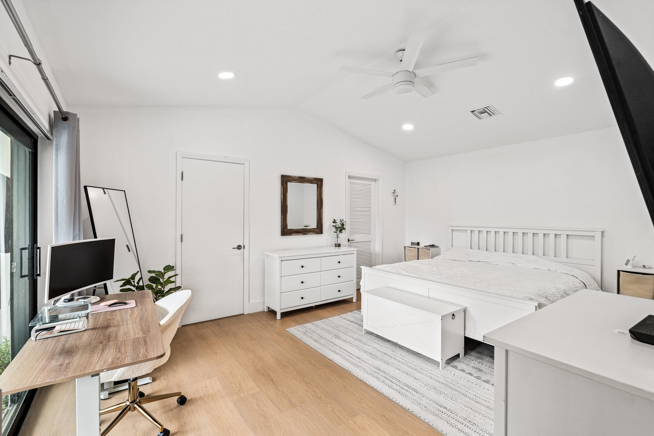 23368 Southwest 53rd Avenue, Unit C Boca Raton, FL 33433 - Photo 11 of 32 a room with furniture and a flat screen tv