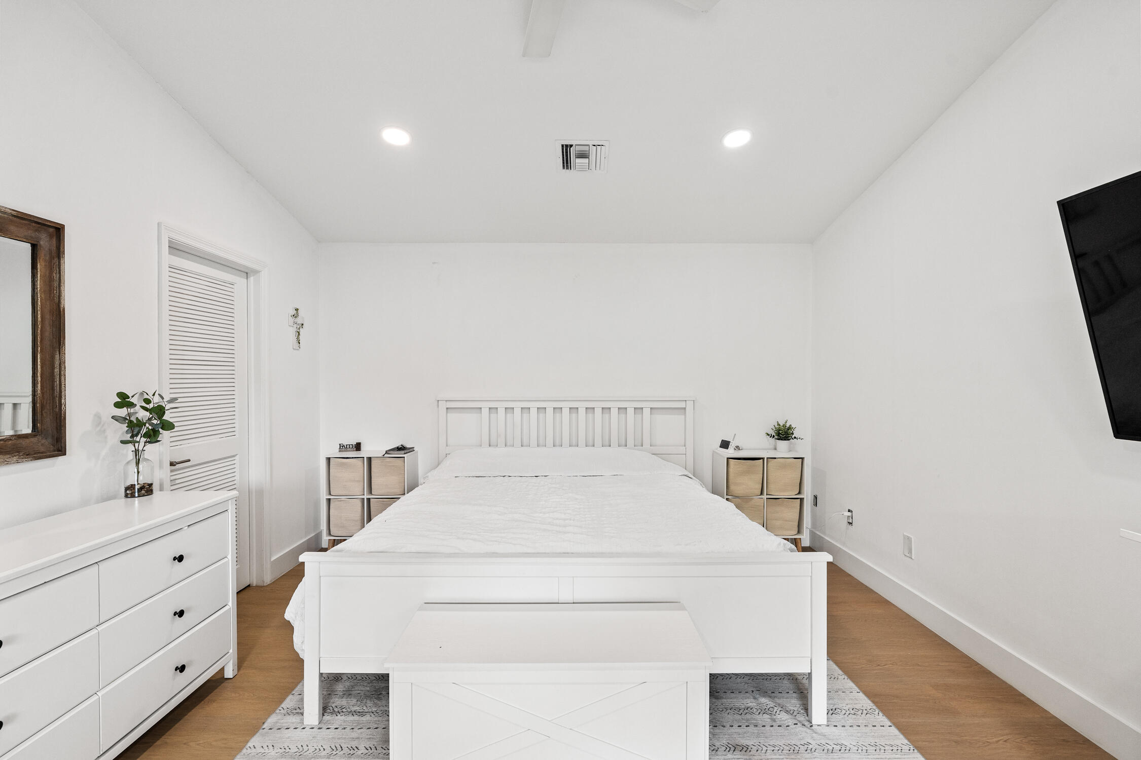 23368 Southwest 53rd Avenue, Unit C Boca Raton, FL 33433 - Photo 12 of 32 a bedroom with a bed and a dresser