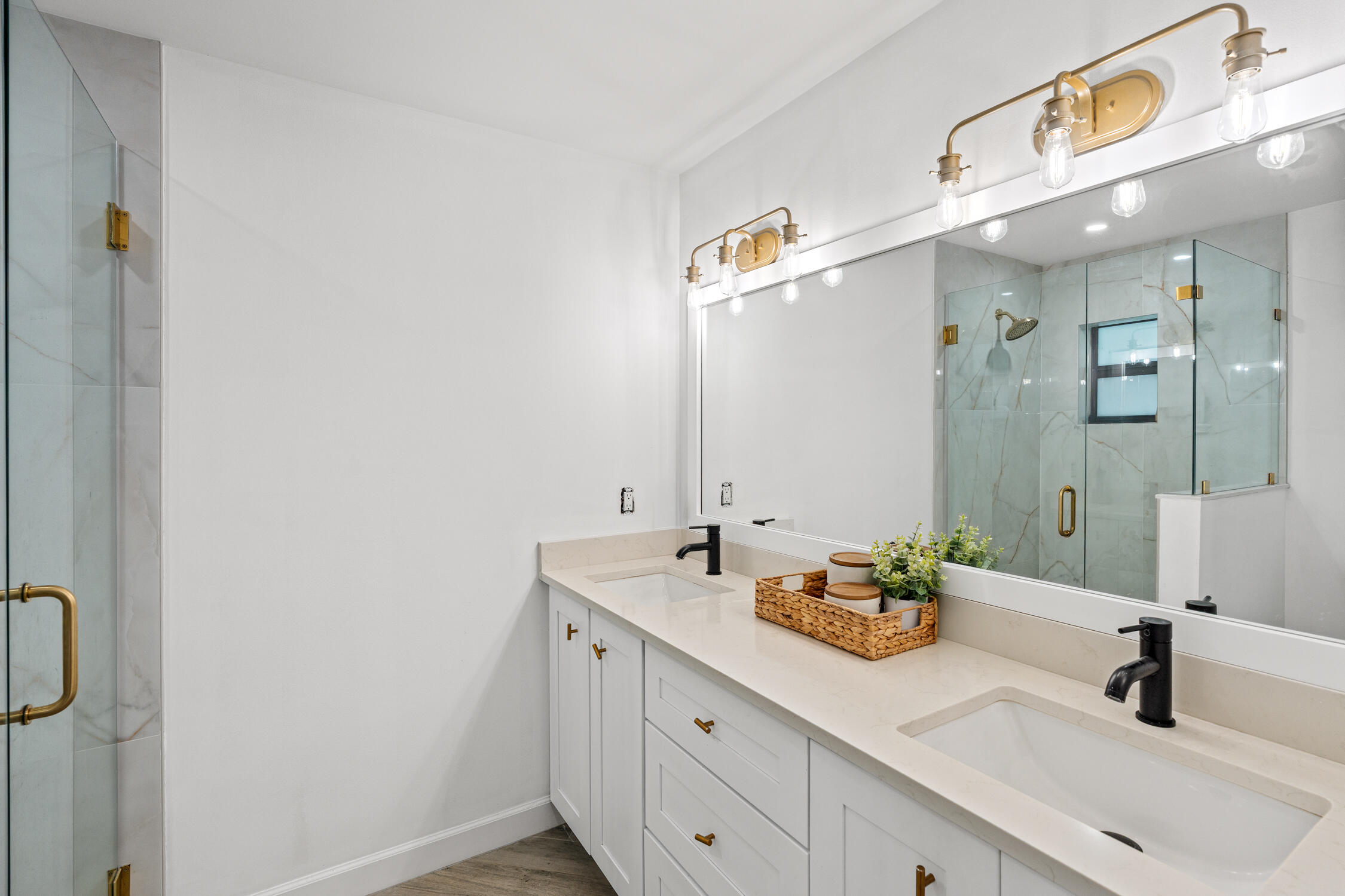 23368 Southwest 53rd Avenue, Unit C Boca Raton, FL 33433 - Photo 16 of 32 a bathroom with a double vanity sink