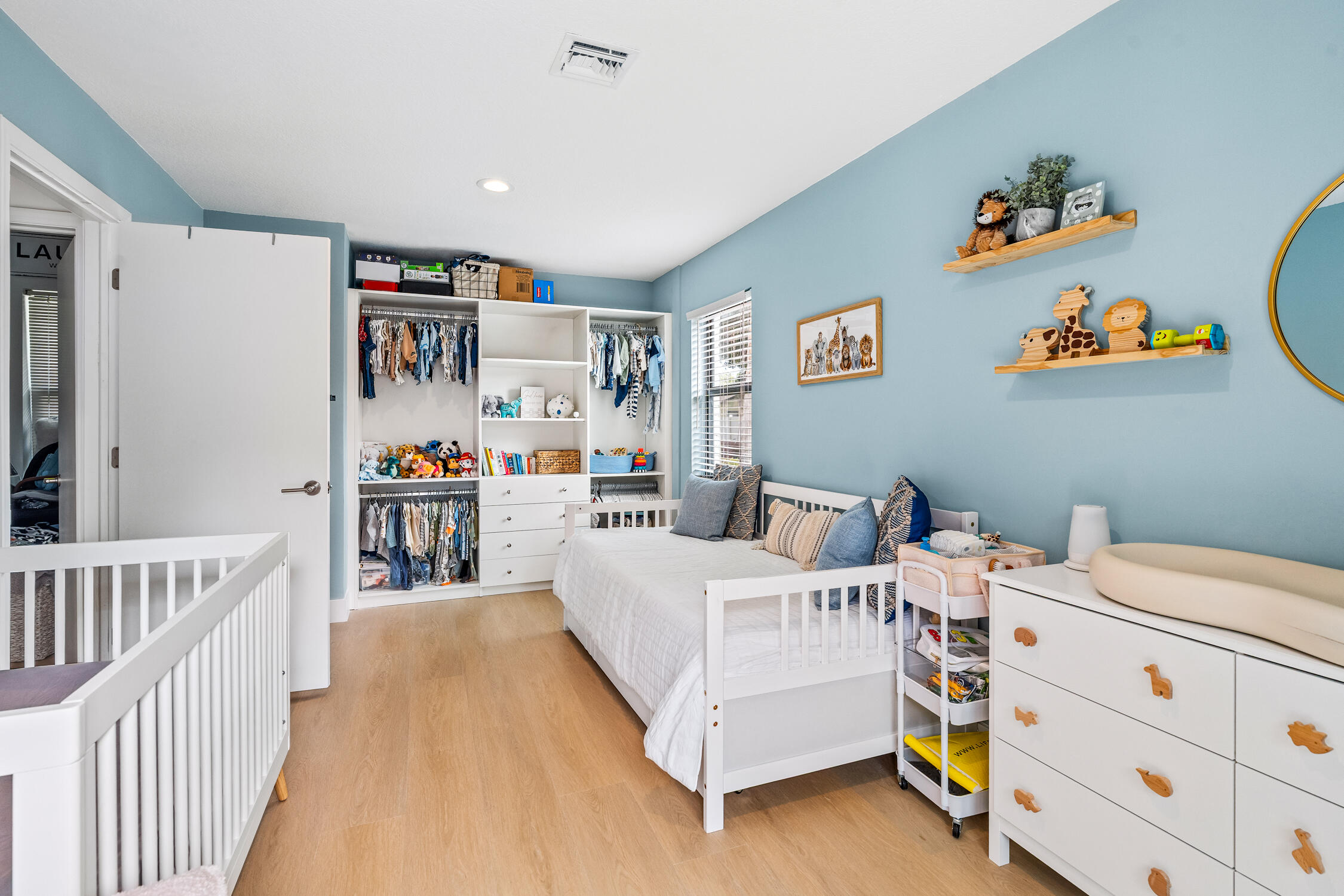 23368 Southwest 53rd Avenue, Unit C Boca Raton, FL 33433 - Photo 17 of 32 a bedroom with a bed and a window