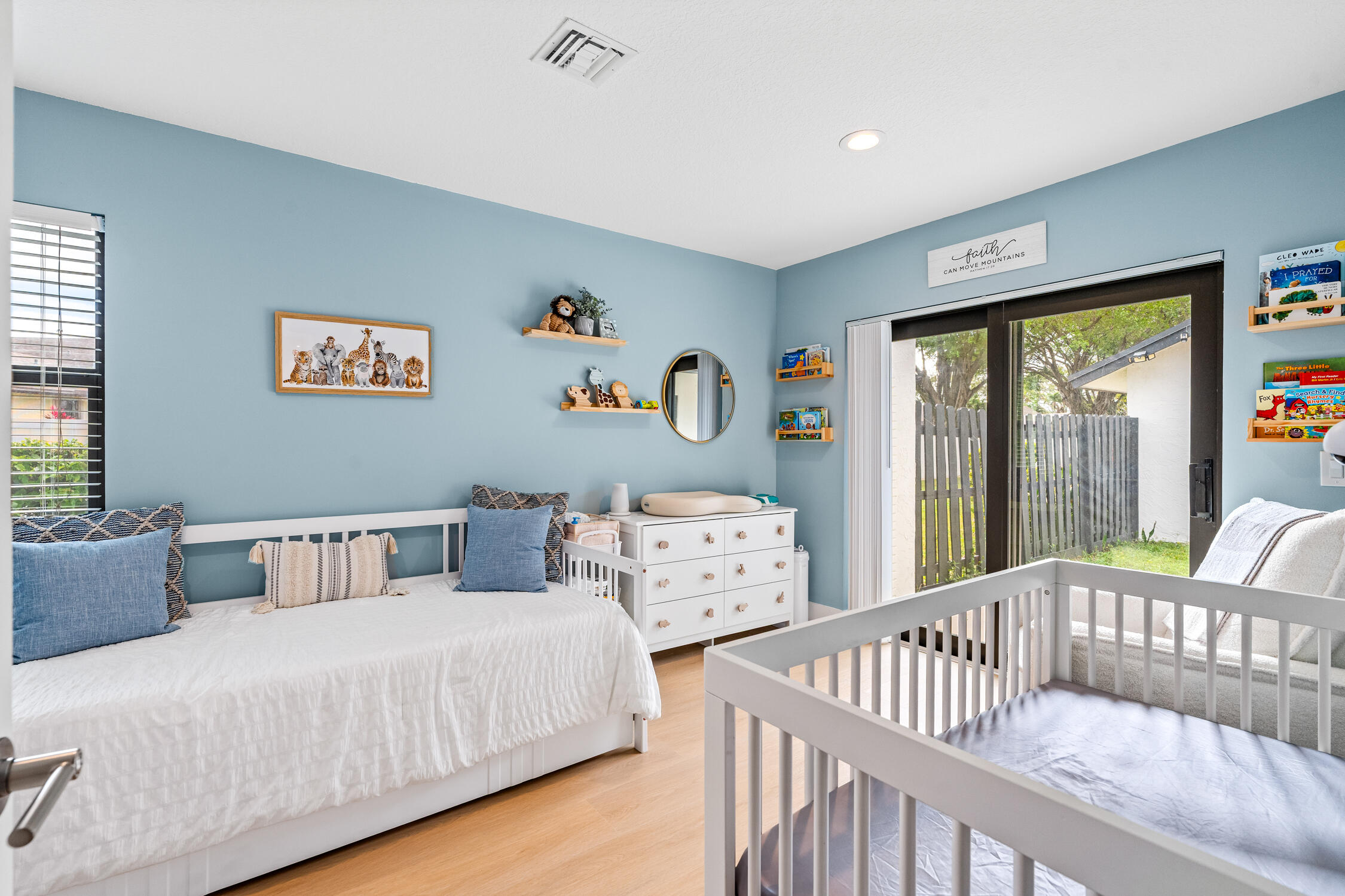 23368 Southwest 53rd Avenue, Unit C Boca Raton, FL 33433 - Photo 18 of 32 a bedroom with two beds and a large window