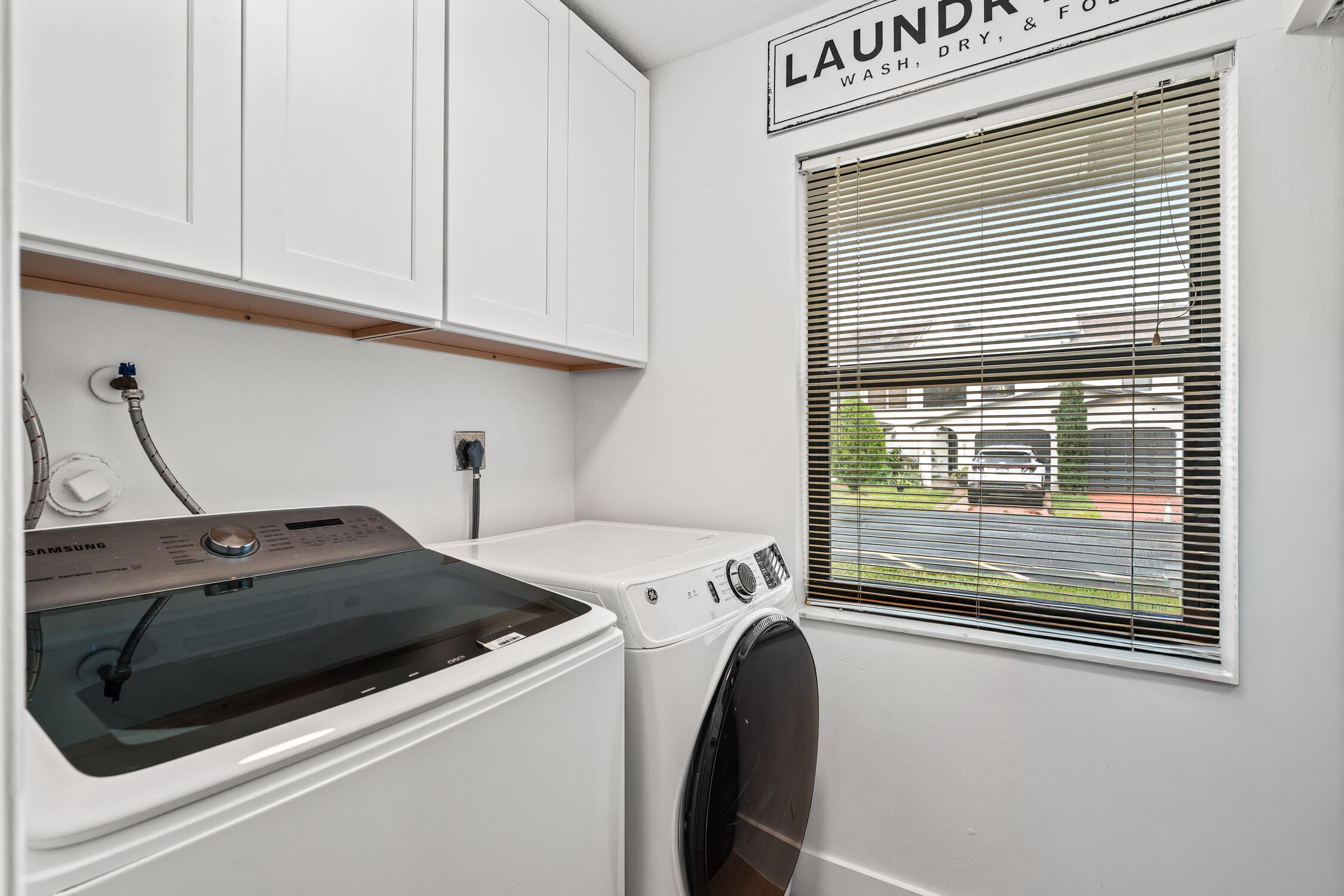 23368 Southwest 53rd Avenue, Unit C Boca Raton, FL 33433 - Photo 21 of 32 a utility room with dryer and washer