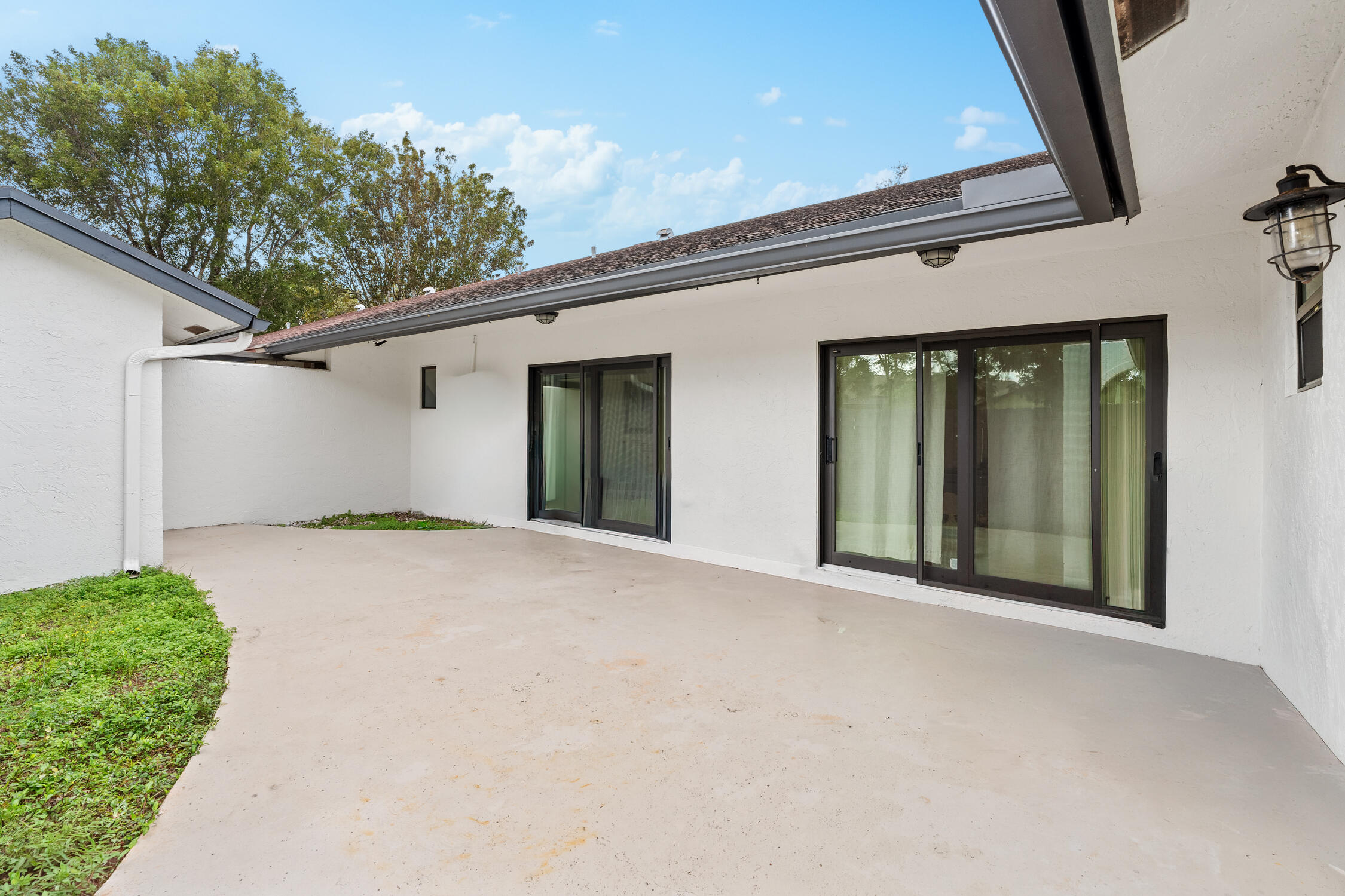 23368 Southwest 53rd Avenue, Unit C Boca Raton, FL 33433 - Photo 22 of 32 a view of a house with a outdoor space