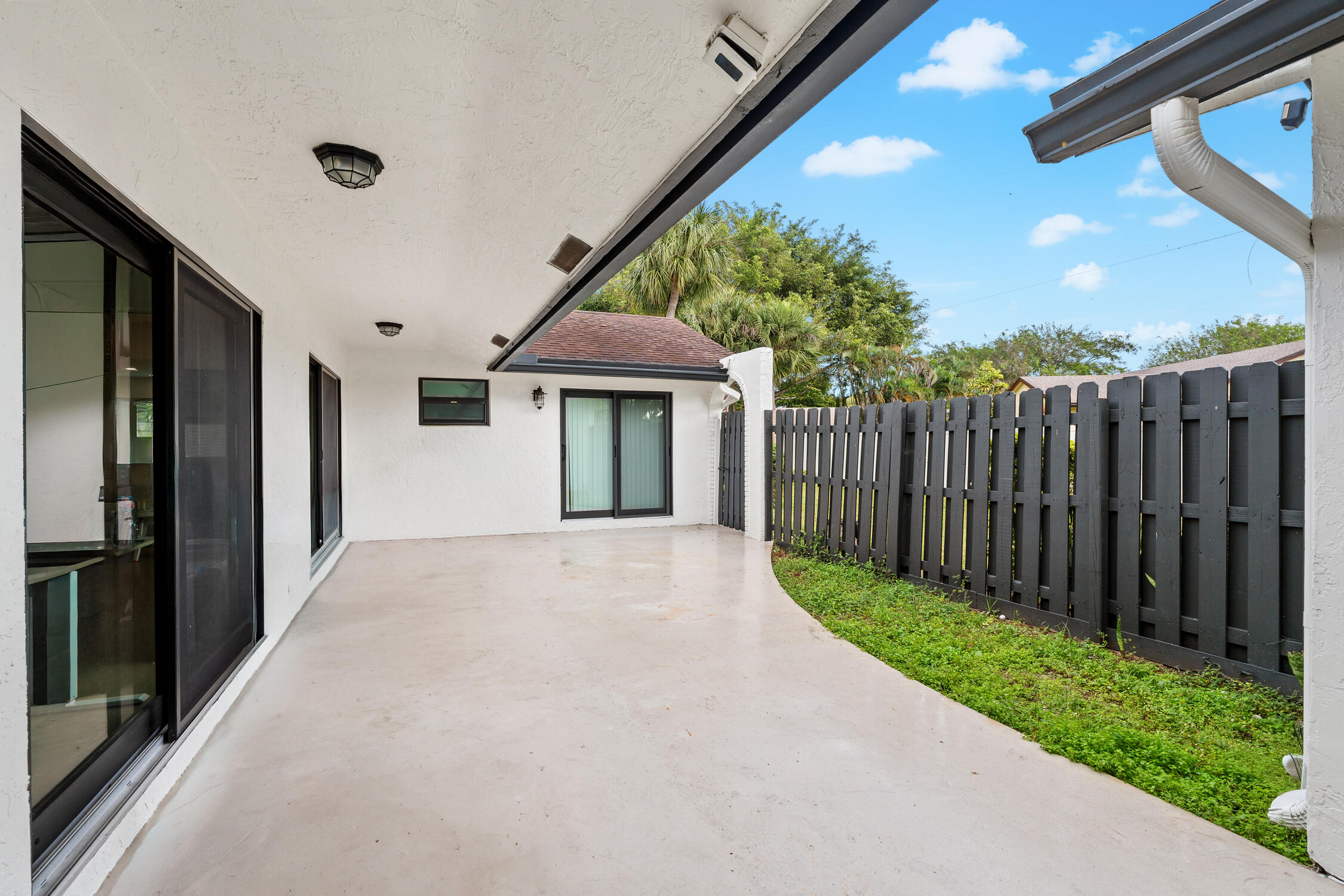 23368 Southwest 53rd Avenue, Unit C Boca Raton, FL 33433 - Photo 23 of 32 a view of a house with backyard and garden