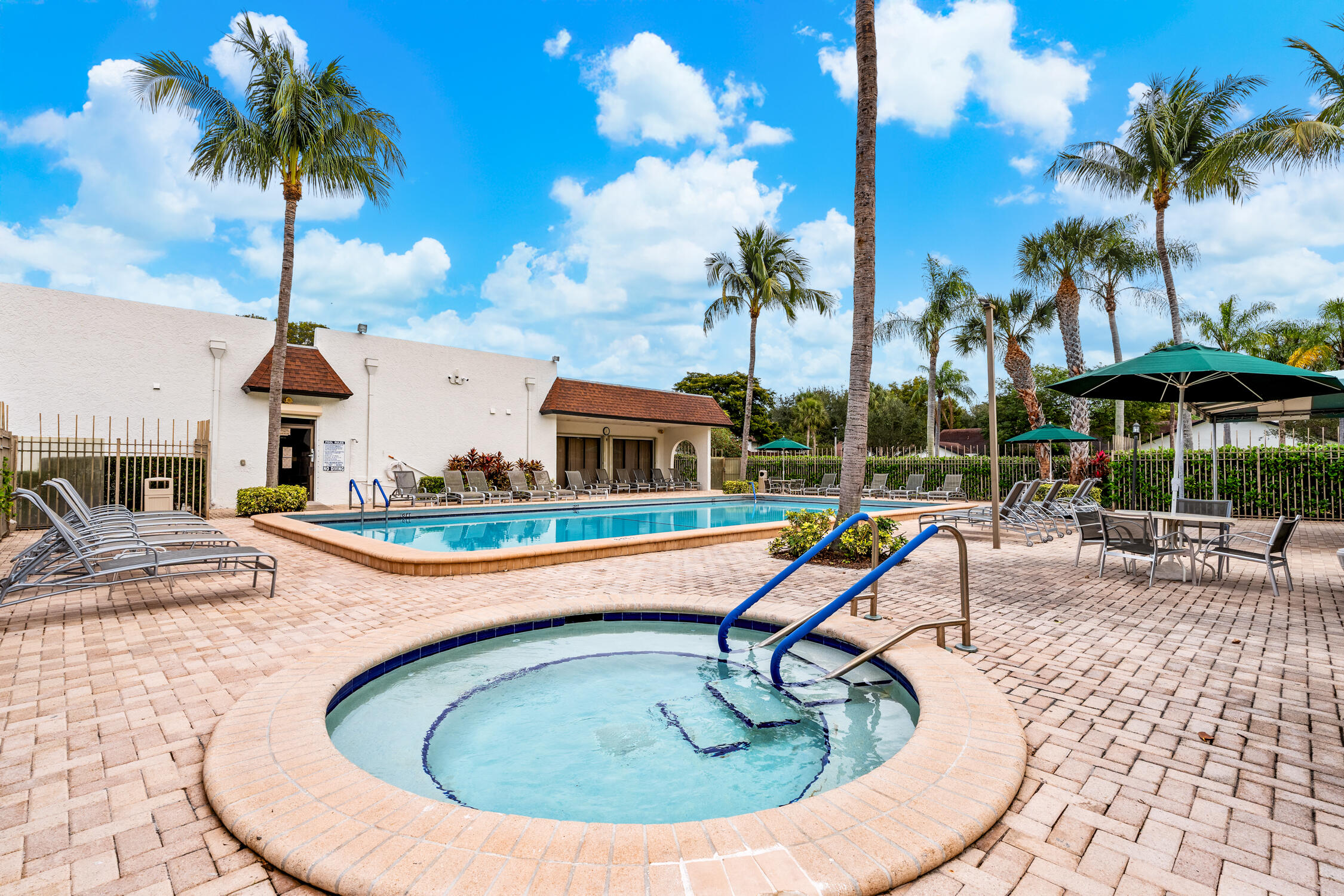 23368 Southwest 53rd Avenue, Unit C Boca Raton, FL 33433 - Photo 27 of 32 a swimming pool with outdoor seating