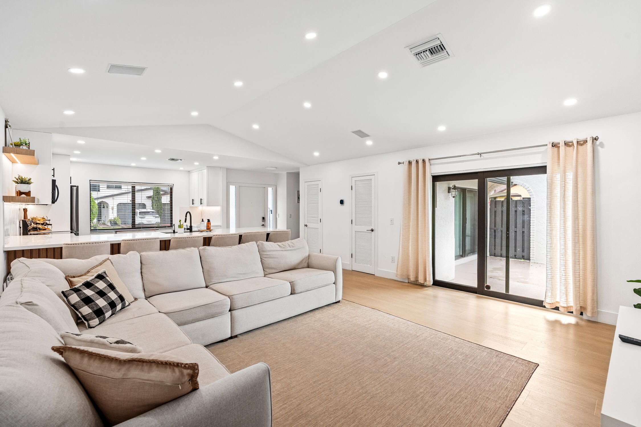 23368 Southwest 53rd Avenue, Unit C Boca Raton, FL 33433 - Photo 10 of 32 a living room with furniture and a large window