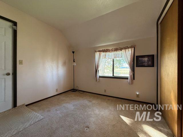 848 Jonathan Road Weiser, ID 83672 - Photo 16 of 42 Unfurnished room with carpet and vaulted ceiling