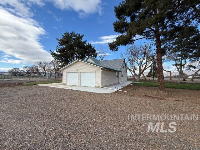 848 Jonathan Road Weiser, ID 83672 - Photo 29 of 42 Garage with concrete driveway