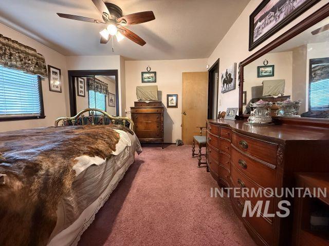 848 Jonathan Road Weiser, ID 83672 - Photo 10 of 42 Bedroom featuring dark carpet and ceiling fan