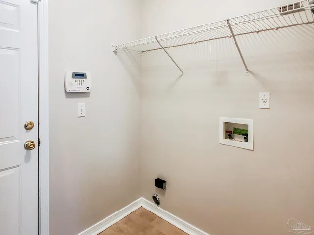 a bathroom with a window and a shower