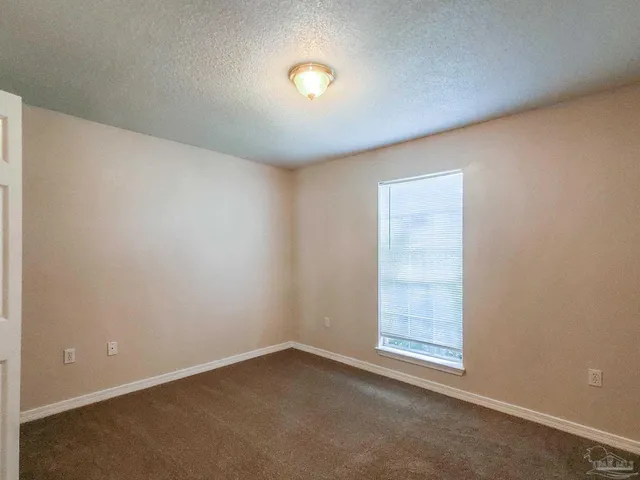 an empty room with a empty space and window