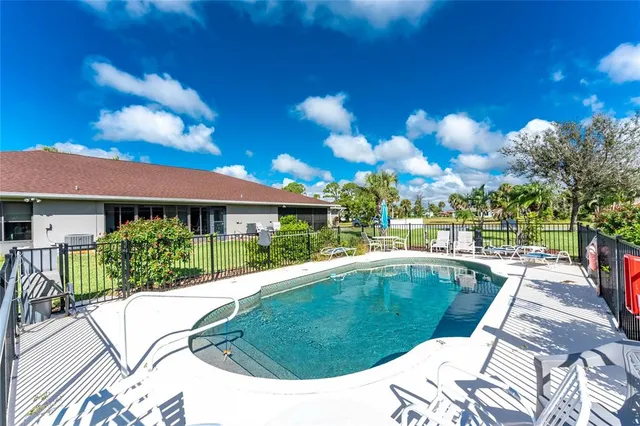 a view of a swimming pool with a patio