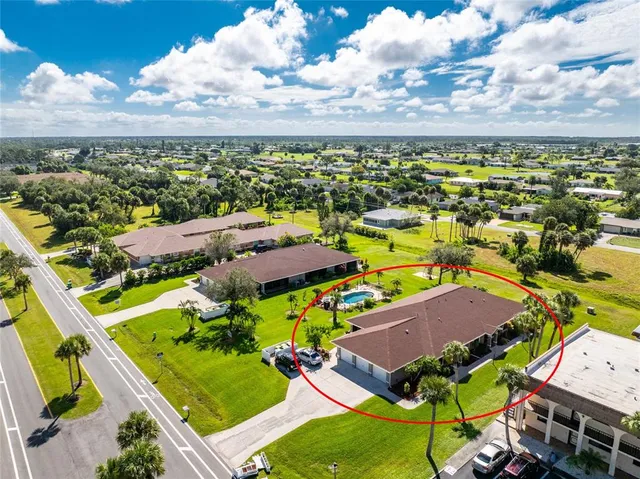 an aerial view of residential building and ocean