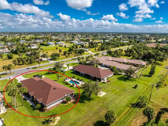 a view of a swimming pool with a yard