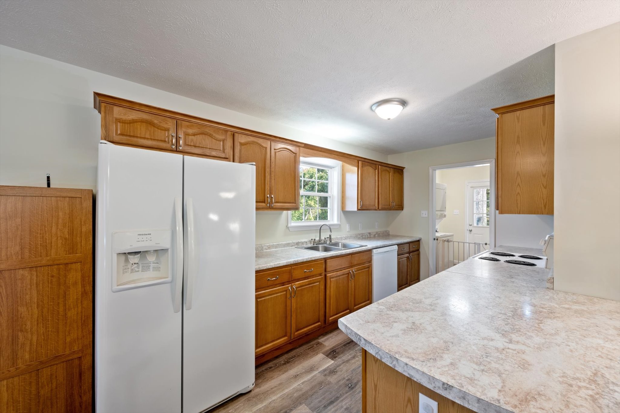 1318 Yellow Creek Road Dickson, TN 37055 - Photo 12 of 37 a kitchen with a refrigerator a sink and a stove top oven