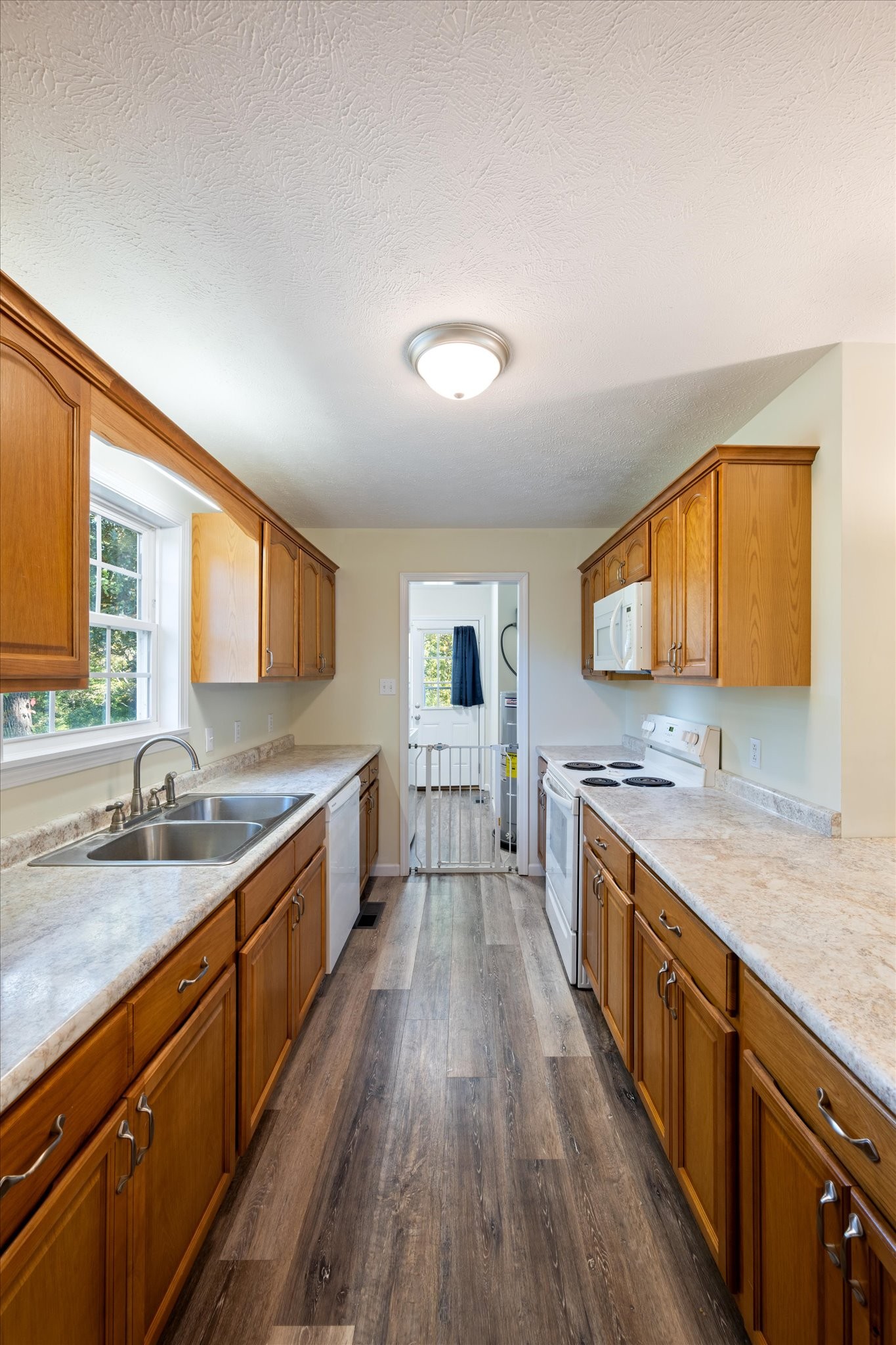 1318 Yellow Creek Road Dickson, TN 37055 - Photo 13 of 37 a large kitchen with a sink and wooden floor