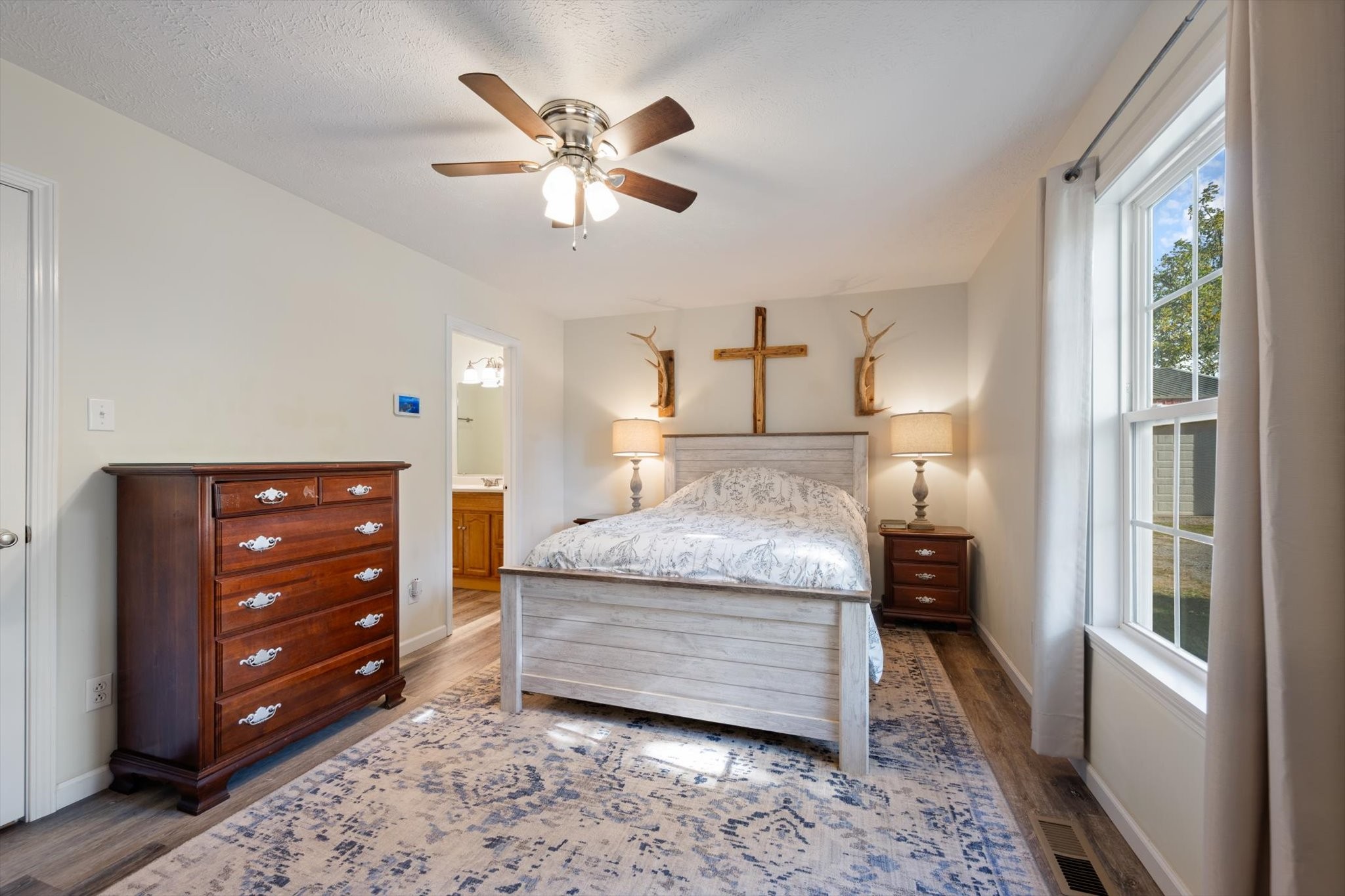 1318 Yellow Creek Road Dickson, TN 37055 - Photo 16 of 37 a living room with a bed and a chandelier
