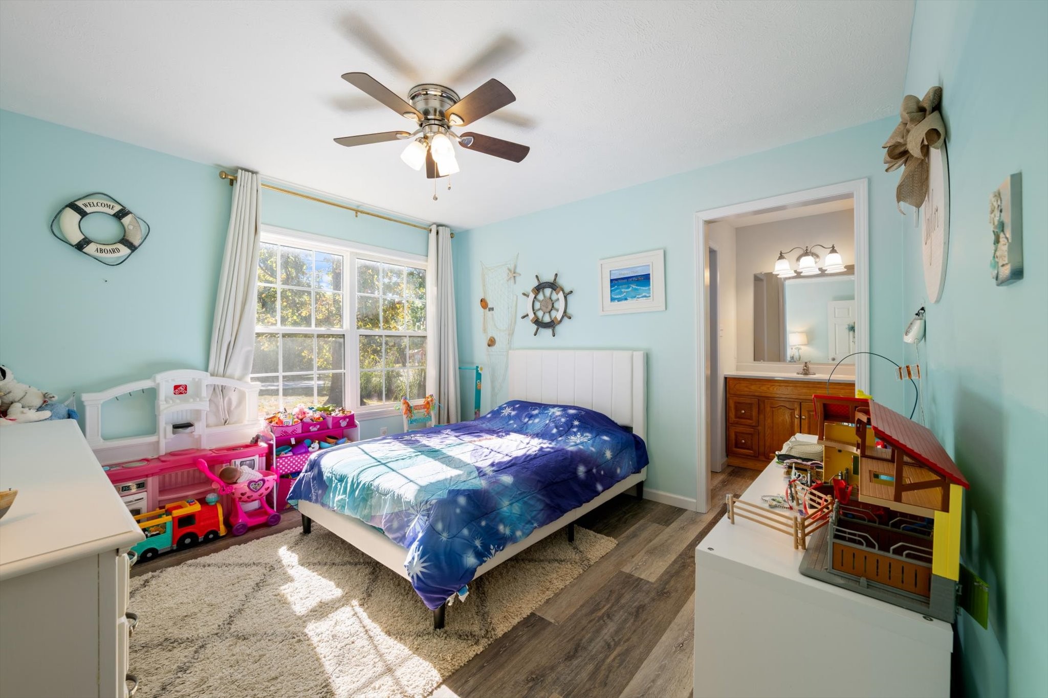 1318 Yellow Creek Road Dickson, TN 37055 - Photo 18 of 37 a bedroom with a bed and a chandelier