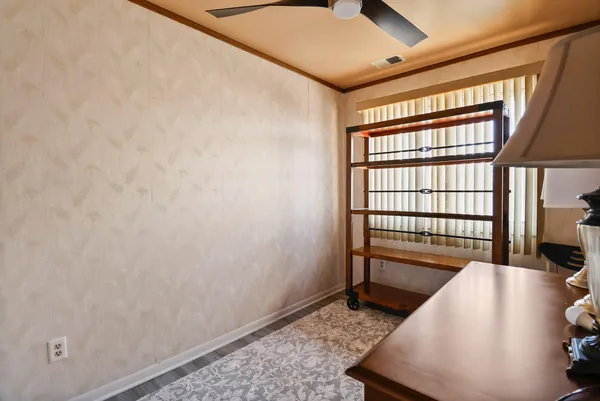 a view of a hallway with windows